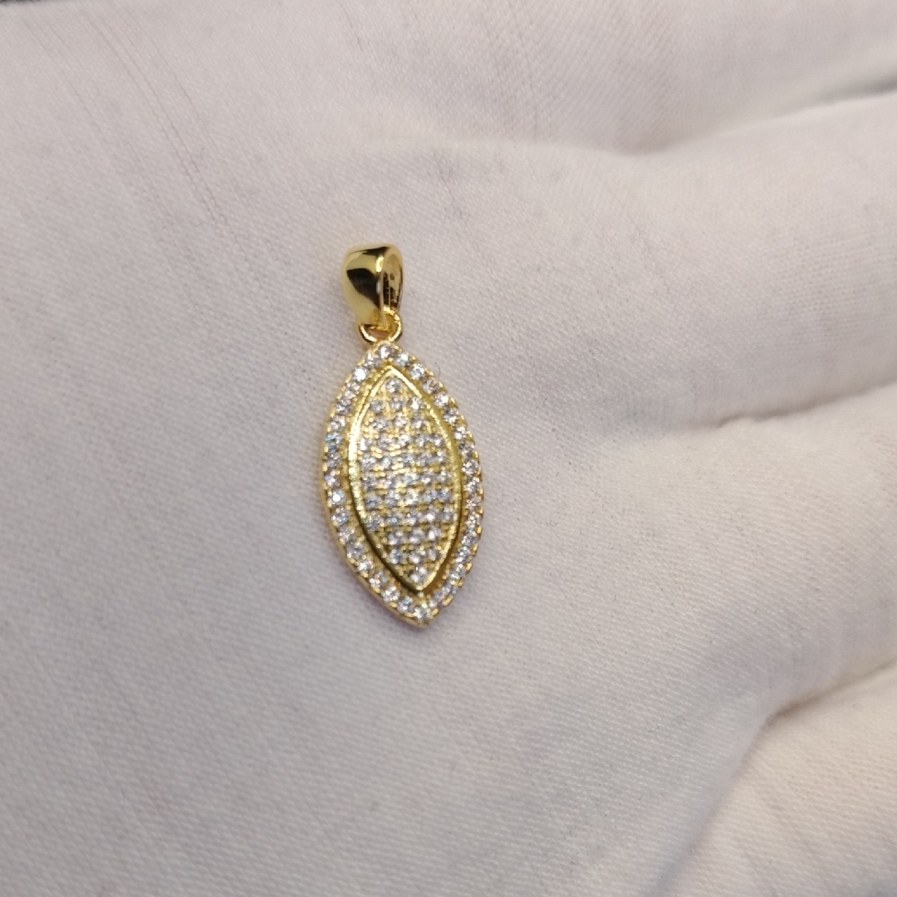 stunning gold tone pendant with white stones.